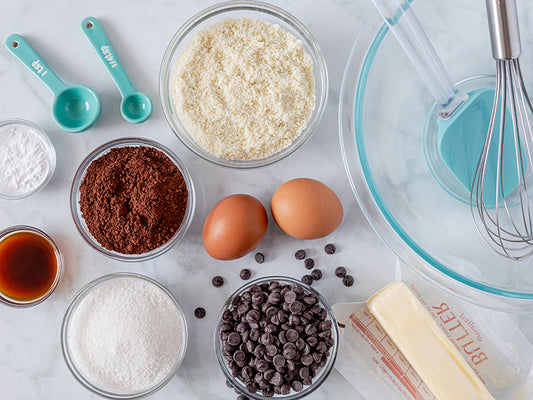 Ingredients used in ketogenic baking: eggs, almond flour, nuts, butter and cacao powder
