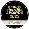 A round black and gold badge with the text beauty shortlist AWARDS 2022 WINNER in the center, highlighting Laponie of Scandinavia's award-winning Balancing Essence Mist for sensitive skin.