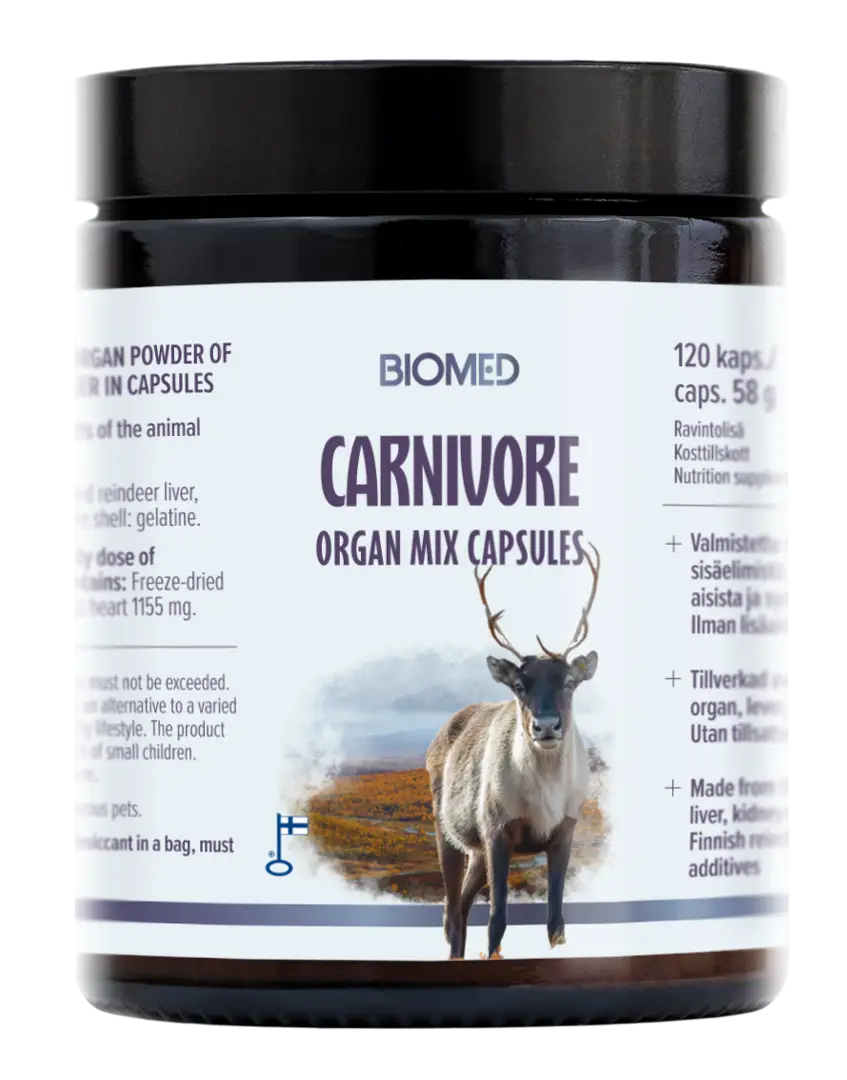 A black jar labeled Biomed Carnivore Organ Mix Capsules from Biomed shows a reindeer on a natural landscape, emphasizing these nutrient-rich capsules made from reindeer organs, with product details and dosage clearly visible on the label.