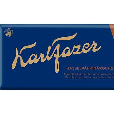 A blue and brown Fazer wrapper with gold lettering showcases milk chocolate squares and chopped hazelnuts. The text reads "Fazer Chopped Hazelnuts Milk Chocolate.