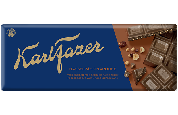 A blue and brown Fazer wrapper with gold lettering showcases milk chocolate squares and chopped hazelnuts. The text reads "Fazer Chopped Hazelnuts Milk Chocolate.