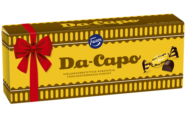 The yellow and brown Fazer Da Capo Praline box by Fazer features a red ribbon design, bilingual Finnish and Swedish text, and images of the wrapped chocolate rum truffle pralines on the packaging.