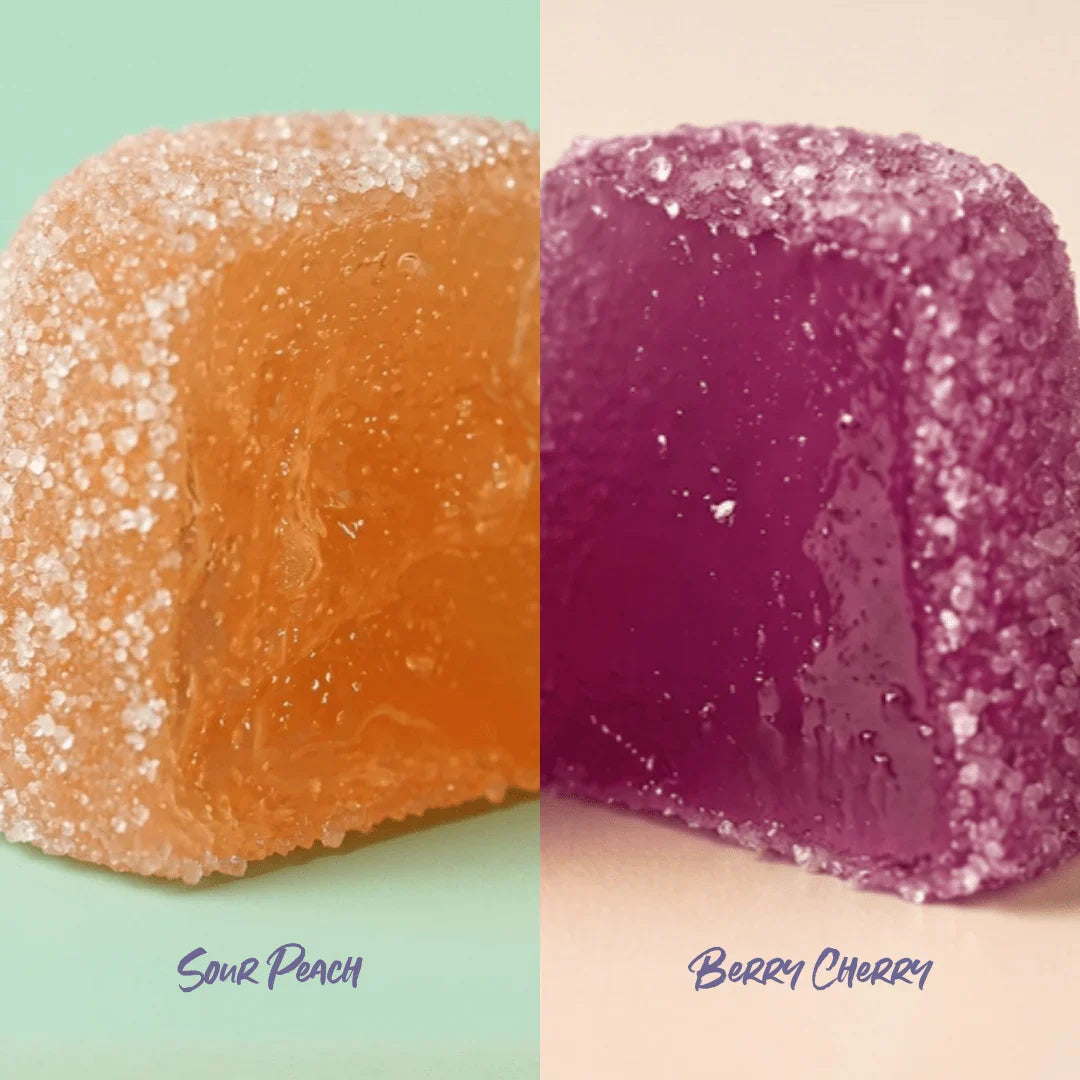Two gummy candies, one orange and one purple, on a split background with 'Sour Peach' and 'Berry Cherry' labels.