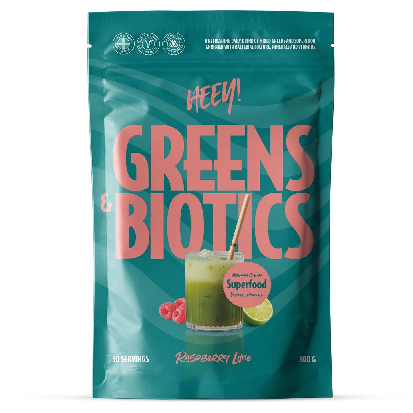 A 300g stand-up pouch of Heey! Greens & Biotics 'Raspberry Lime' powder. The packaging is teal with large pink text and features a graphic of a green smoothie with raspberries and lime on the front.