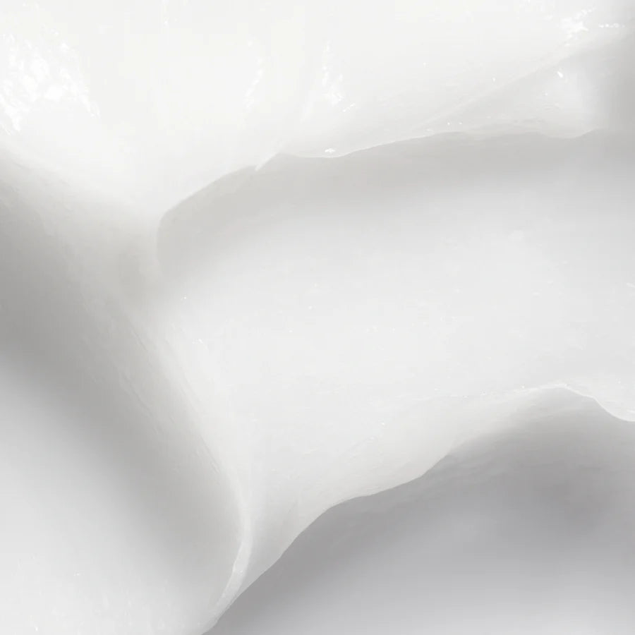 Close-up of Lumene Nordic Hydra Moisture Boost 2-in-1 Hair Mask by Lumene, showing its smooth, creamy white texture with soft highlights that evoke deep hydration.