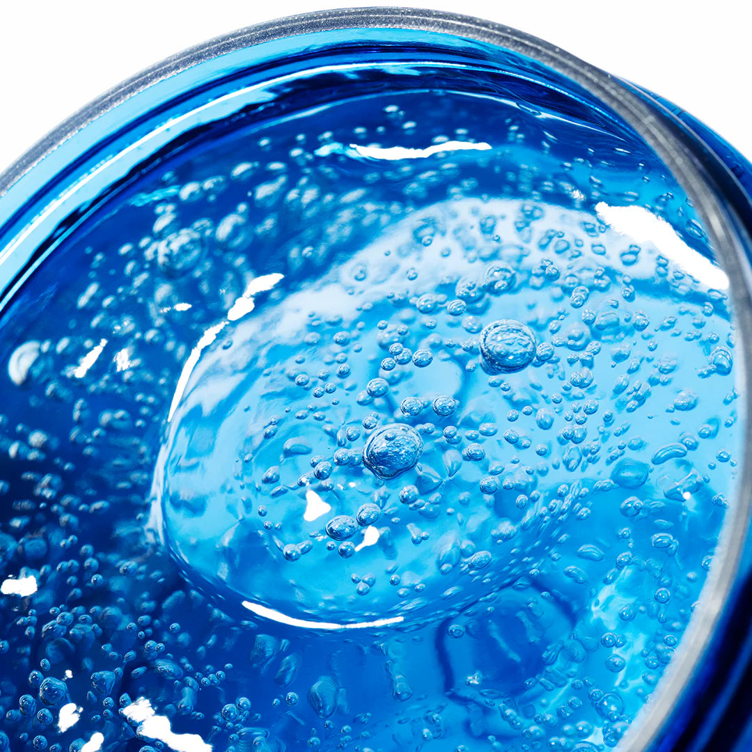 Close-up of Lumene Nordic Hydra Oxygen Recovery 72h Hydra Gel Mask, a bright blue, translucent gel with air bubbles—highlighting innovative Nordic hydration by Lumene.