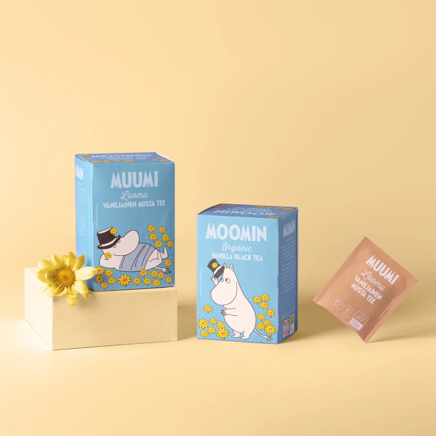 Moomin-themed tea boxes on a beige background