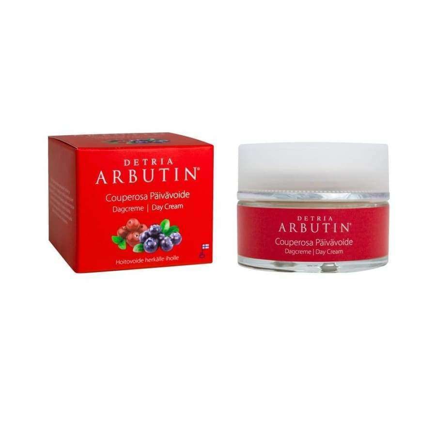 A red box and a matching jar of Detria Arbutin Day Cream for sensitive or couperosa skin are shown side by side on a white background.