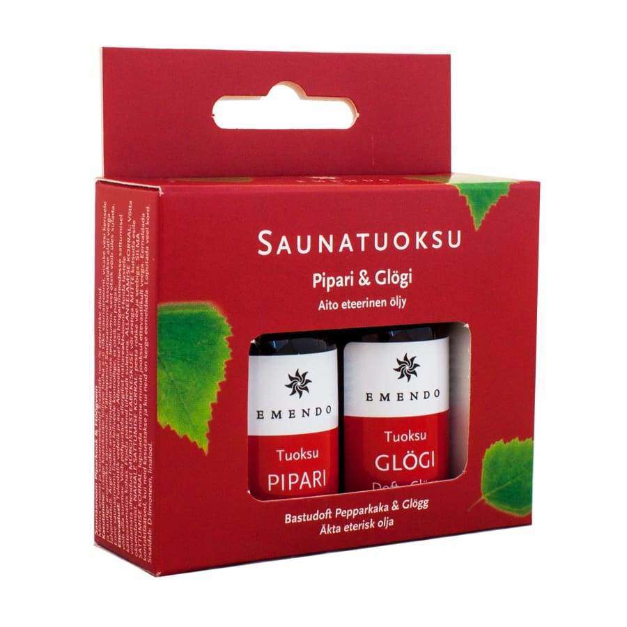A red box of Emendo Sauna Fragrance Gingerbread & Mulled Wine features two bottles. Decorated with green leaf graphics, it evokes a cozy winter atmosphere for an inviting sauna experience. Brand: Emendo.