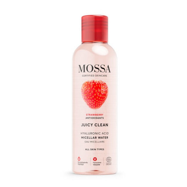 A clear bottle of Mossa Juicy Clean Micellar Water by Mossa, with a red cap and strawberry image on the label, features antioxidant-rich strawberry extract. This vegan, hydrating facial cleanser suits all skin types.