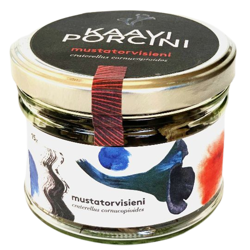 A glass jar with a black lid contains Kaavi Porcini Dried Black Trumpet mushrooms, featuring artistic colorful brushstroke label designs and showcasing Finnish flair.
