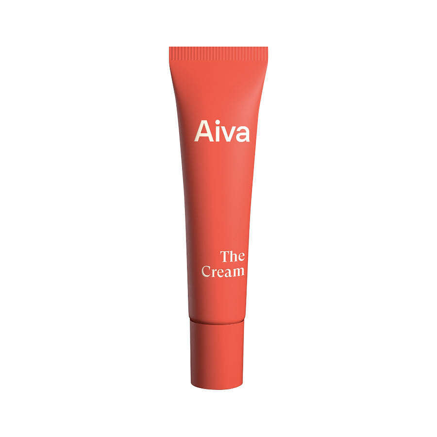 An upright red tube labeled “Aiva” at the top and “The Cream” near the bottom, featuring bilberry seed oil for antioxidant benefits, displayed on a plain white background.