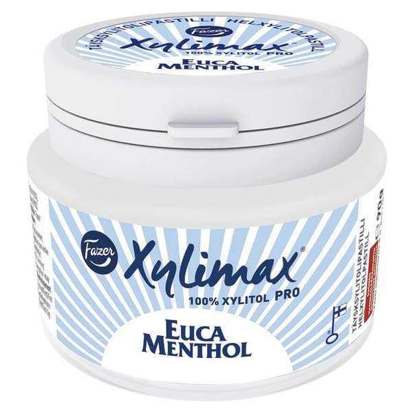 A white plastic container of Fazer Xylimax Eucamenthol Full Xylitol Pastilles by Fazer, featuring a blue and white label and twist-off lid; ideal for dental health with a refreshing eucalyptus menthol flavor.