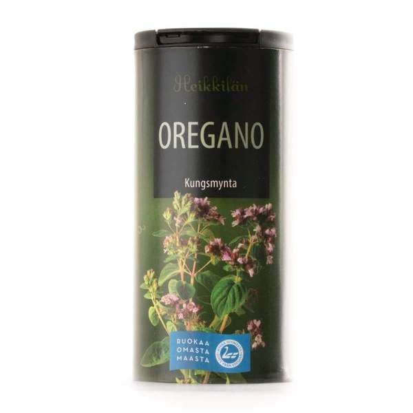 Heikkilä's Oregano comes in a cylindrical container with a black lid, green background, and oregano plant images. Text in Finnish and English makes it ideal for seasoning Italian pizza herbs.
