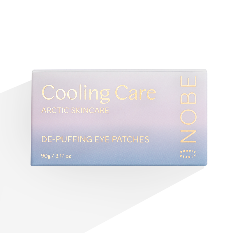 Die 90g-Pastellbox "NOBE Cooling Care De-Puffing Eye Patches" von NOBE Nordic Beauty bietet mit ihrem minimalistischen Design kühlende Feuchtigkeit unter den Augen.