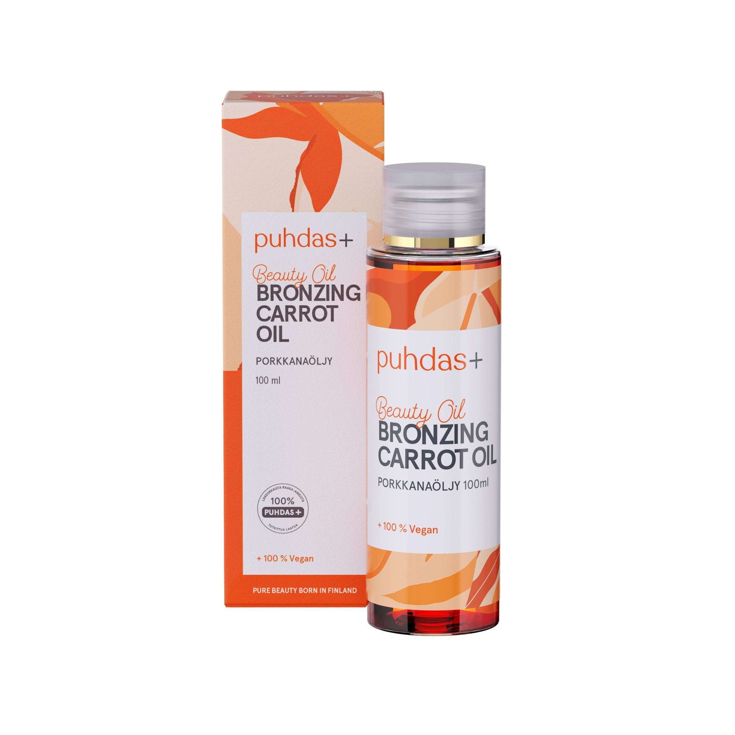 Eine 100-ml-Flasche Puhdas+ Beauty Bronzing Carrot Oil steht neben der passenden orange-weiĂen Schachtel mit Blattmotiven und zweisprachigen englisch-finnischen Produktinformationen.