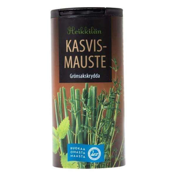 Ein zylindrischer Behälter mit Heikkilä's Vegetable Seasoning von Heikkilä's, verziert mit Bildern von frischen Kräutern und beschriftet in Finnisch und Schwedisch.