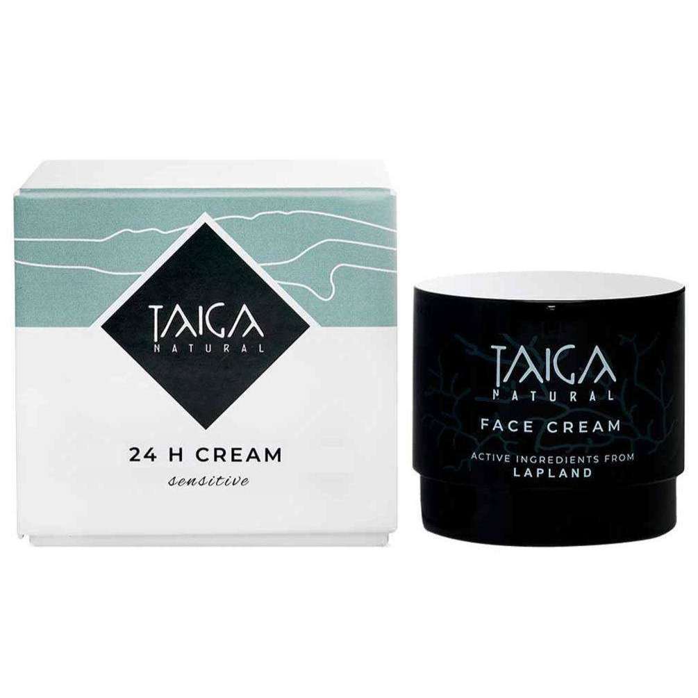 Un pot et une boîte de Taiga Cosmetics 24 H Cream Sensitive, au design minimaliste blanc et bleu sarcelle, mettent en valeur cette crème nourrissante pour le visage, élaborée à partir d'ingrédients naturels de Laponie et destinée aux peaux sensibles.