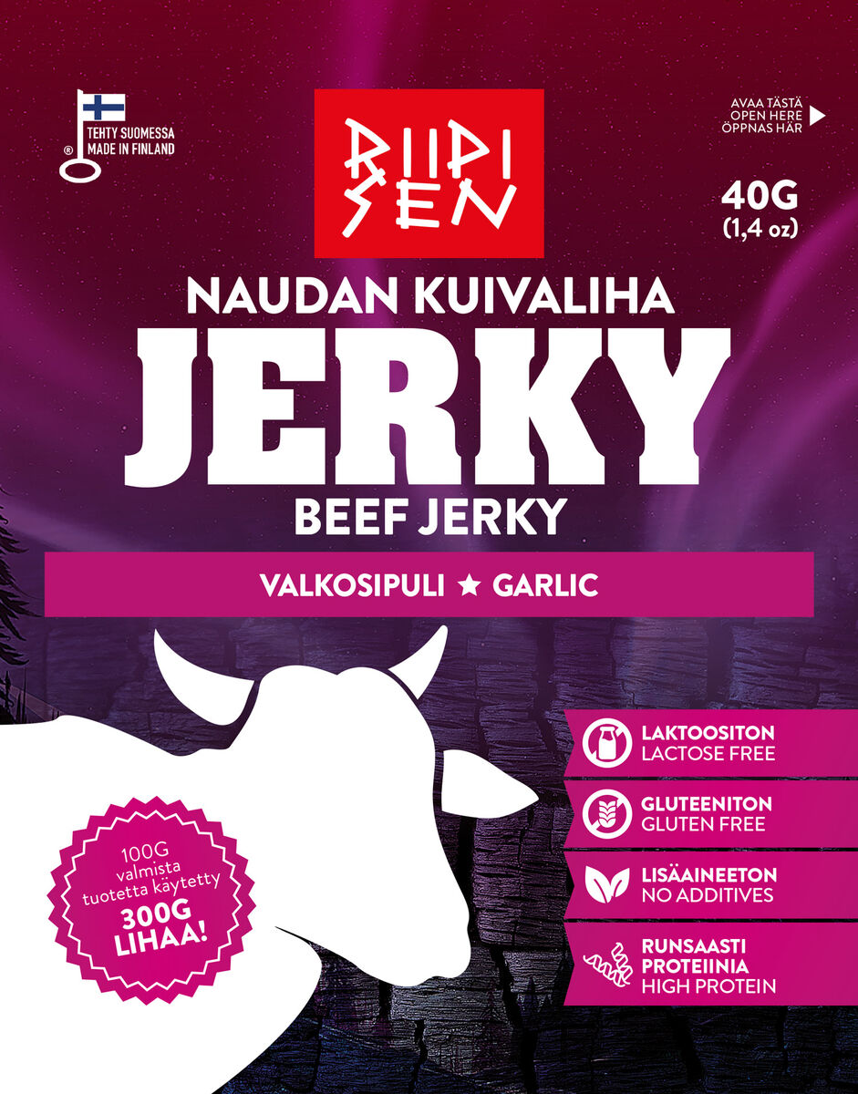 Confezione da 40 g di Riipisen Beef Jerky Garlic, prodotto con roast beef finlandese affumicato. Presenta uno sfondo viola con la sagoma di una mucca e icone che indicano che il prodotto è privo di lattosio, glutine e additivi e ad alto contenuto proteico. Testo in finlandese e inglese.