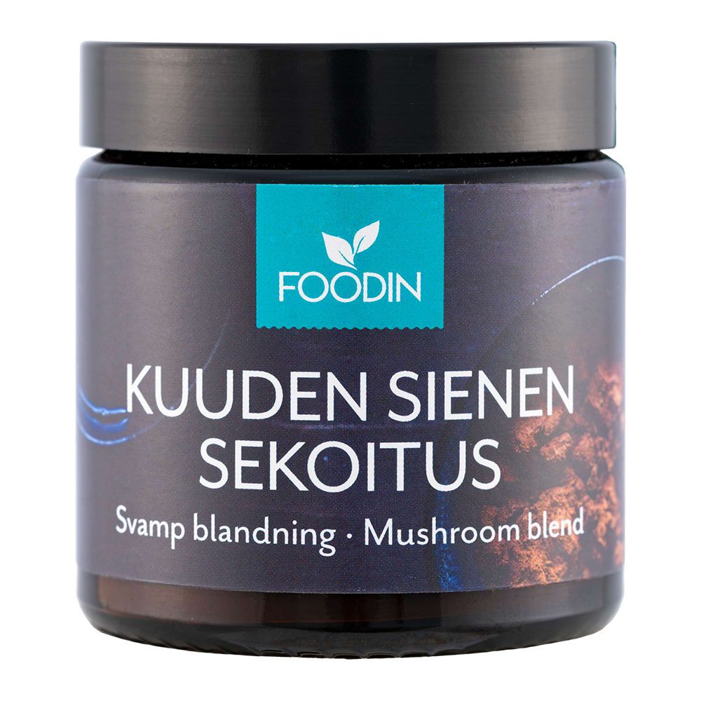 Een donkere pot met het label Foodin Six Mushroom Mix, met een blauw bladlogo op de bovenkant en de witte ondertitel "Svamp blandning · Mushroom blend"; dit veelzijdige voedingssupplement met zes soorten paddenstoelen is van Foodin.
