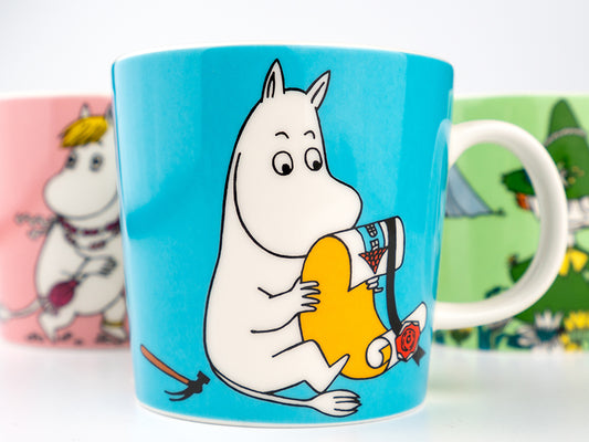 Moomin mugs on white background