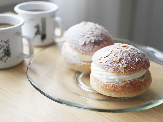 Two Scandinavian shrove buns and coffee cups