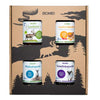 The Biomed Gift Set Reindeer by Biomed includes four jars: reindeer bone broth, bone broth powder, liver capsules, and organ capsules. The box features black woodland art with tree patterns and a reindeer silhouette.