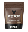 A 500g brown resealable pouch of DENSE Beef Protein Cocoa features a bull icon and highlights its lactose-free, hydrolyzed beef protein powder.
