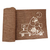 The Emendo Moomin Bench Cover by Emendo is a brown textured sauna bench cover featuring two cartoon Moomin characters sitting on a bench under a crescent moon, with one holding flowers.