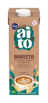 A 1-liter carton of Fazer Aito Oat Drink Barista by Fazer, designed for coffee. The packaging features oat stalks, coffee beans, a latte art cup on a brown and teal background, and is labeled vegan.