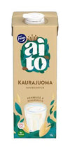 A 1-liter beige carton of Fazer Aito Oat Drink by Fazer, made from Nordic oats, is shown with green leaves, a glass of the plant-based vegan beverage, and text in Finnish and Swedish.