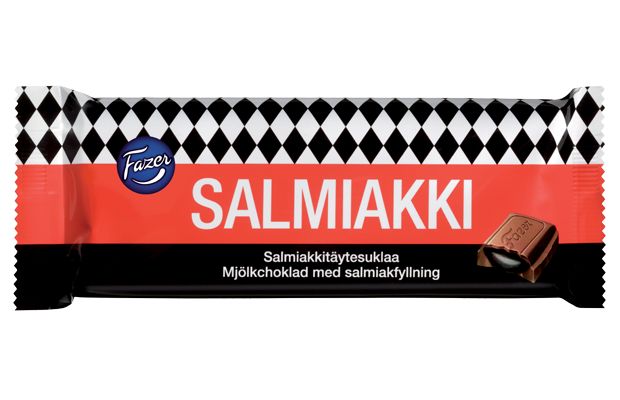 A Fazer Salty Liquorice Chocolate bar by Fazer, in packaging with black-and-white diamonds, a red background, and an image of a chocolate piece with salty liquorice filling. Finnish and Swedish text highlight this classic Finnish treat.