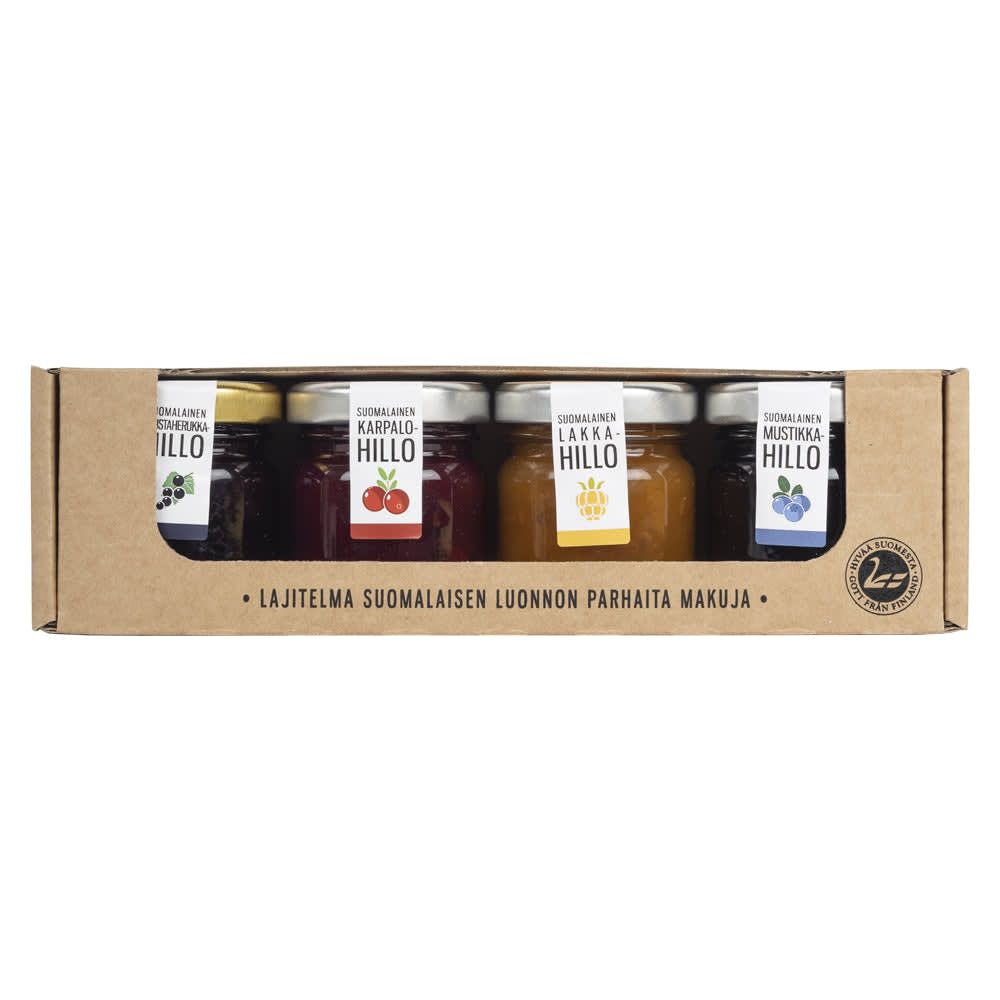 The Poikain Parhaat Finnish Assortment of Jams includes five small jars, each with unique berry labels, neatly arranged in a cardboard box featuring Finnish text—a delightful gift for jam lovers.
