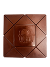 A square chocolate bar with a geometric segmented design and an embossed monogram logo in the center, isolated on a white background.