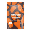 A 70g pouch of Goodio Organic Oat Chocolate Beans Original, featuring an orange and dark brown abstract pattern. This organic, vegan chocolate from Goodio is gluten-free and made with 22% gluten-free oats.