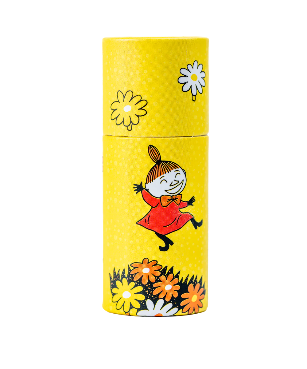 The Gustaf & Linnea Moomin Lipbalm Little My comes in a yellow cylindrical container featuring cartoon flowers and Little My jumping joyfully—ideal for storing your favorite eco-friendly lip balm.