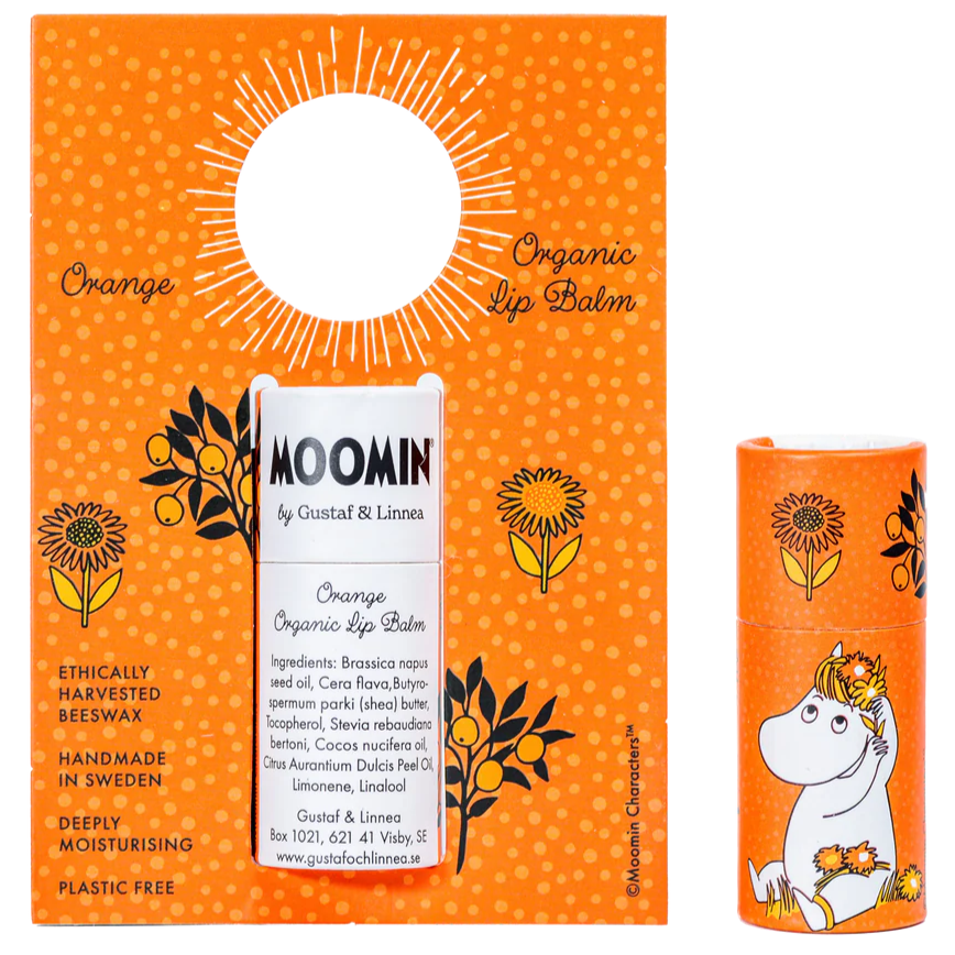 The Gustaf & Linnea Moomin Lipbalm Snork Maiden features an orange floral package with Snork Maiden in a flower crown. Handmade in Sweden, it uses ethical beeswax and natural ingredients for moisturizing, eco-friendly, plastic-free care.