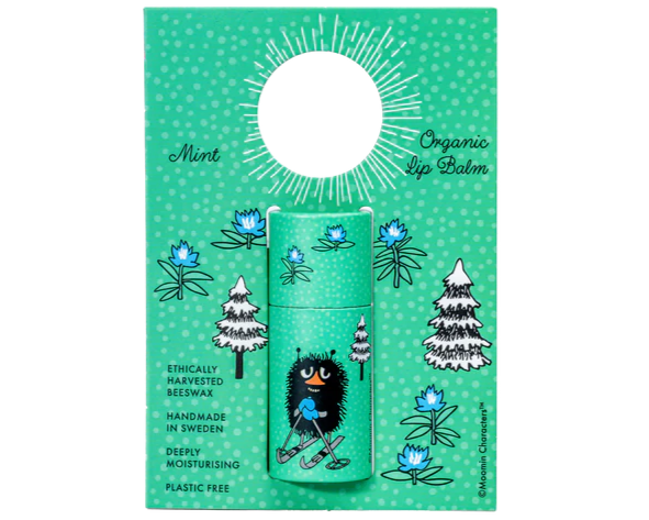 The mint-green Gustaf & Linnea Moomin Lipbalm Stinky features a cartoon skier, snowy trees, and blue flowers. It highlights fresh mint flavor, Swedish beeswax, handmade eco-friendly formula, and plastic-free packaging.
