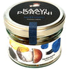 A glass jar with a gold lid labeled Kaavi Porcini Dried Porcini by Kaavi Porcini. The label displays painted Finnish porcini mushrooms and colorful blue, yellow, and black brushstrokes.