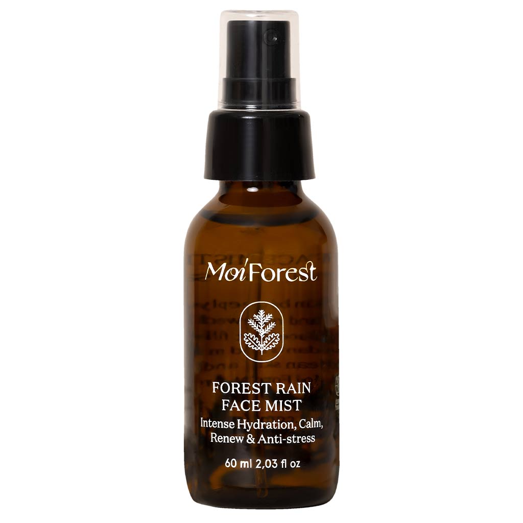 Mo'Forest Forest Rain Face Mist in a 60 ml amber glass spray bottle with a black pump dispenser, shown on a plain white background.