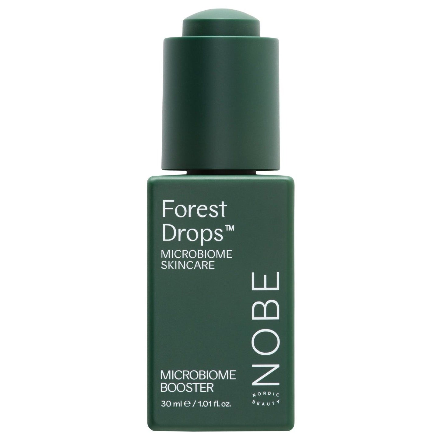 A dark green bottle of NOBE Nordic Beauty’s Forest Drops® Microbiome Booster, featuring white text and formulated with forest microbiome extract to restore the skin barrier, shown against a plain white background.