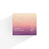 A box of NOBE Oat Wonder® Calming Moisturizer, 50 ml by NOBE Nordic Beauty—a vegan moisturizer with Fazer Oat Oil for sensitive skin. The beige and purple gradient packaging displays product details in white and gold.