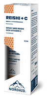 A white and blue box labeled Nordaid Reishi + Vitamin C Spray (30ml) features honeycomb designs, a mountain logo, and text in Finnish and Swedish. Contains reishi mushroom for immune support.