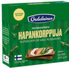 A green box of Oululainen Rye Crisp Bread Rosemary displays Finnish and Swedish text, an image of this wholegrain snack with sliced radish and herbs on top, plus rosemary sprigs featured on the packaging.