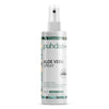 A bottle of puhdas+ Aloe Vera Spray on a clean white background. The bottle is white with a clear spray top and features a label with green and beige botanical patterns.
