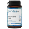A bottle of Puhdas+ Anti Gray Hair supplement, featuring a dark amber brown bottle, a black cap, and a white label with blue accents and text.