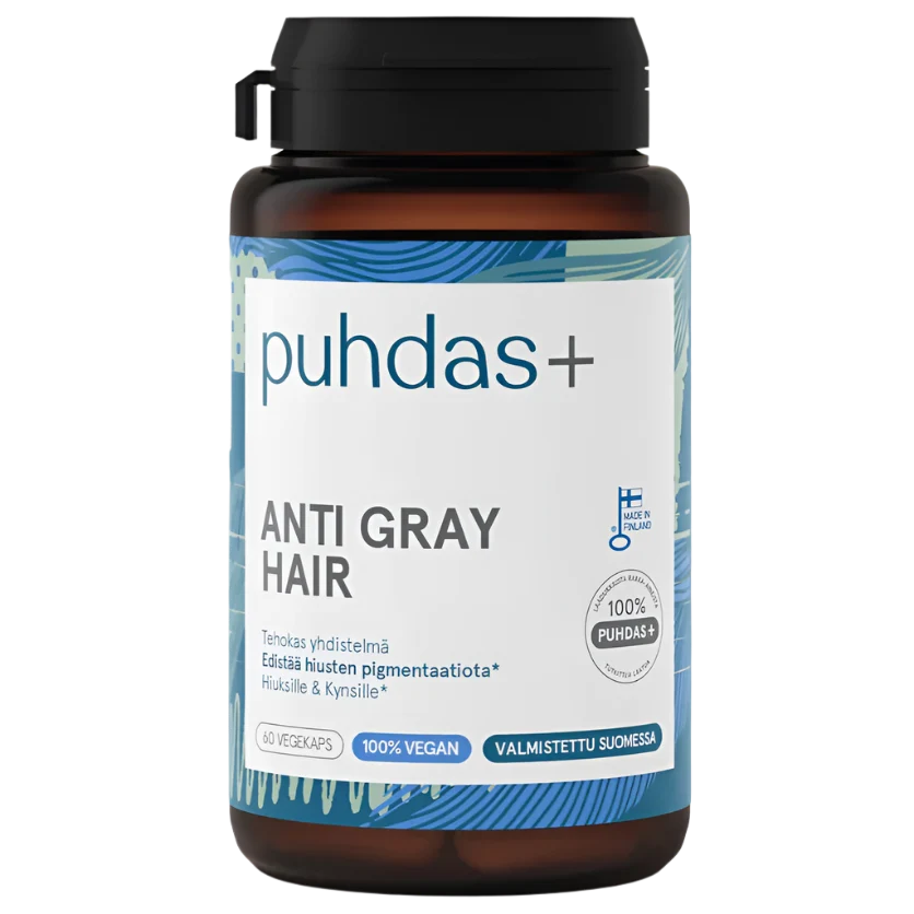 A bottle of Puhdas+ Anti Gray Hair supplement, featuring a dark amber brown bottle, a black cap, and a white label with blue accents and text.