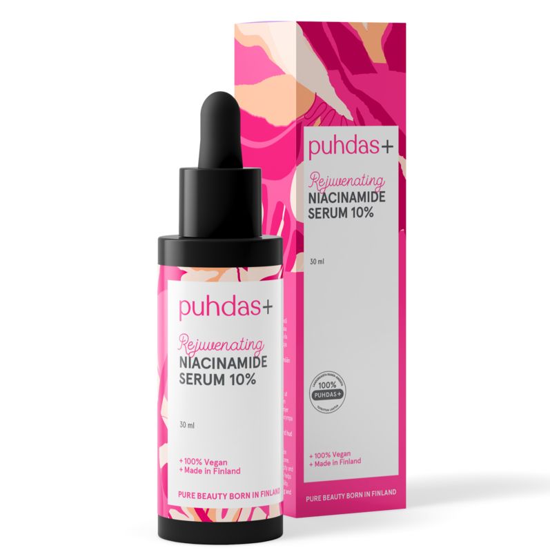 A bottle of puhdas+ Rejuvenating Niacinamide Serum 10% with a black dropper cap stands in front of its matching pink and white retail box on a clean white background.