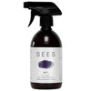A brown spray bottle labeled SEES Dishwashing Liquid by SEES Company features a purple brushstroke and promotes its 100% natural, biodegradable, eco-friendly formula with blood orange essential oil.