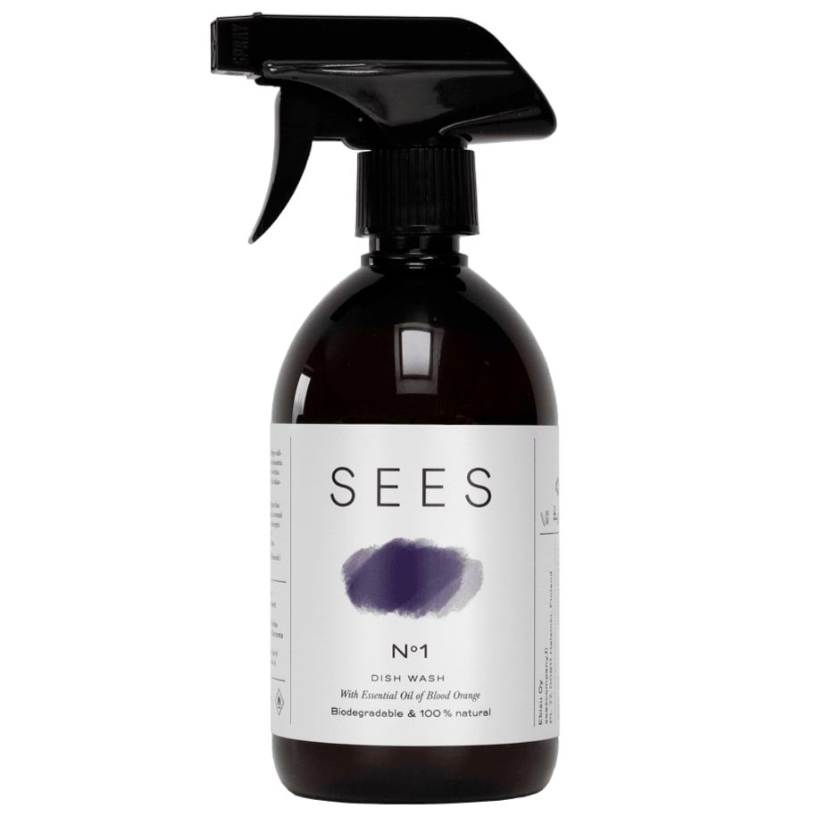 A brown spray bottle labeled SEES Dishwashing Liquid by SEES Company features a purple brushstroke and promotes its 100% natural, biodegradable, eco-friendly formula with blood orange essential oil.
